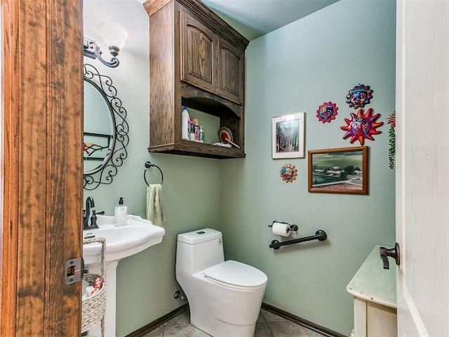 73 Sonata Ln, Shawnee, OK 74804 - half bathroom featuring toilet and tile patterned flooring