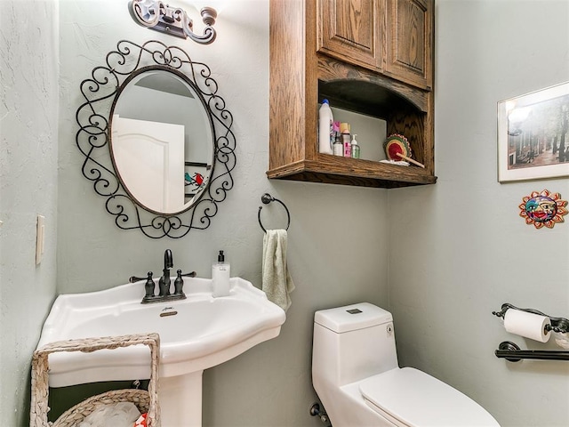 73 Sonata Ln, Shawnee, OK 74804 - half bathroom with toilet and a sink