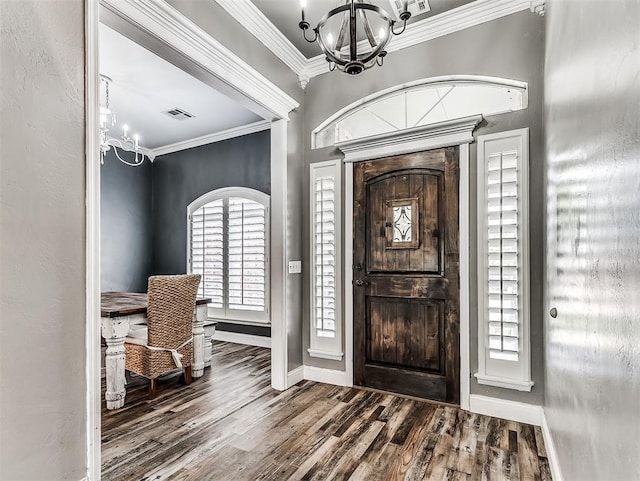 2044 Yorkshire Dr, Midwest City, OK 73130 - foyer with a chandelier, crown molding, and wood finished floors