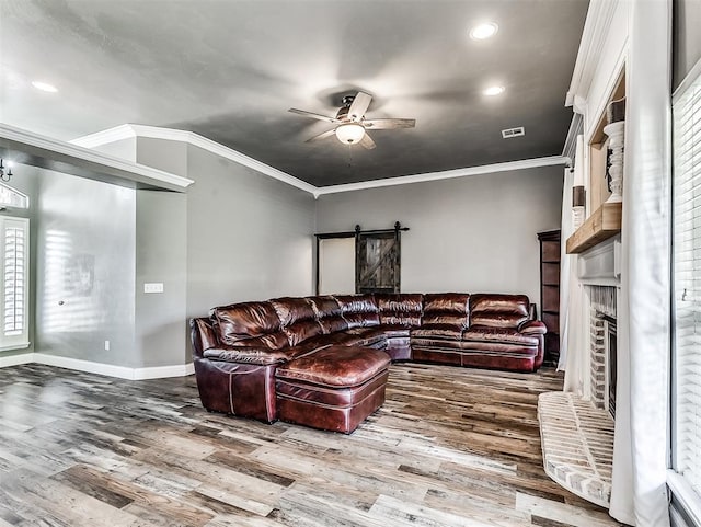 2044 Yorkshire Dr, Midwest City, OK 73130 - living area featuring a ceiling fan, wood finished floors, ornamental molding, a fireplace, and recessed lighting