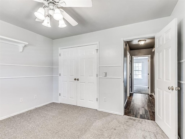 2044 Yorkshire Dr, Midwest City, OK 73130 - unfurnished bedroom with carpet floors, a closet, and a ceiling fan
