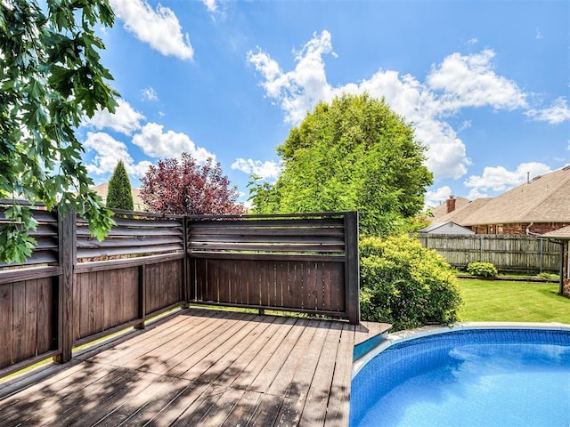2044 Yorkshire Dr, Midwest City, OK 73130 - view of pool with a wooden deck and a fenced backyard