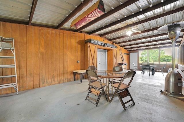 22117 E 1250th Rd, Rocky, OK 73661 - dining room featuring wooden walls, concrete flooring, and ceiling fan