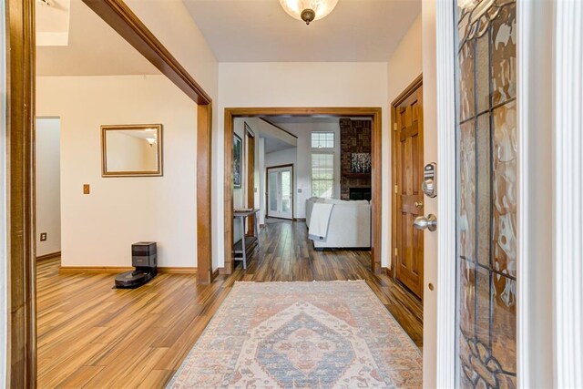 11409 SW 109th St, Mustang, OK 73064 - foyer with wood finished floors and a large fireplace