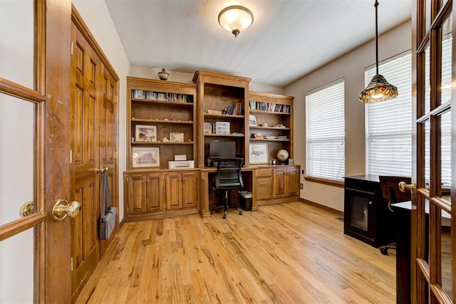 11409 SW 109th St, Mustang, OK 73064 - home office with light wood-style flooring and built in study area