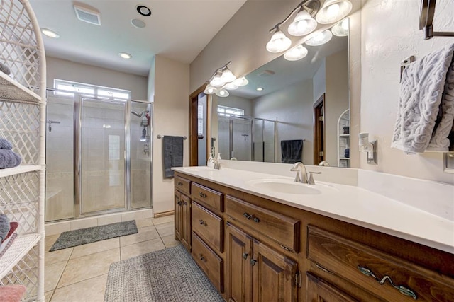 11409 SW 109th St, Mustang, OK 73064 - bathroom with double vanity, tile patterned flooring, and a shower stall