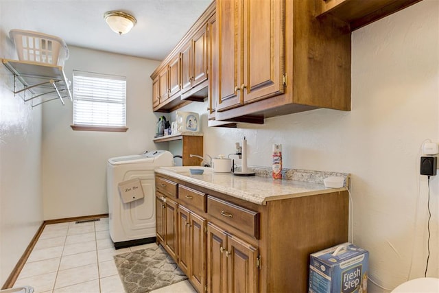 11409 SW 109th St, Mustang, OK 73064 - laundry area with independent washer and dryer, light tile patterned flooring, and cabinet space