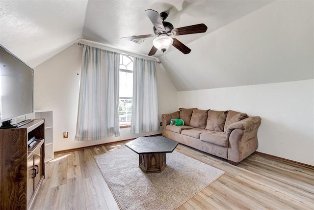 11409 SW 109th St, Mustang, OK 73064 - living area featuring a ceiling fan, vaulted ceiling, and light wood-type flooring