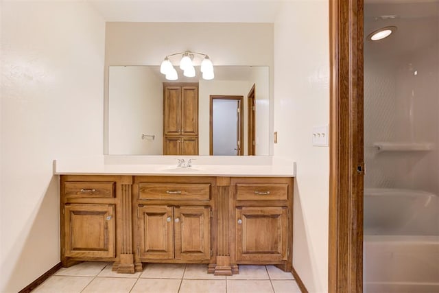 11409 SW 109th St, Mustang, OK 73064 - bathroom with vanity, tile patterned floors, and a bath