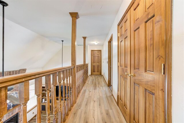 11409 SW 109th St, Mustang, OK 73064 - hallway with light wood-type flooring and lofted ceiling