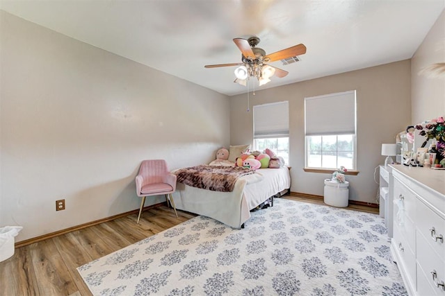 11409 SW 109th St, Mustang, OK 73064 - bedroom featuring light wood finished floors and a ceiling fan