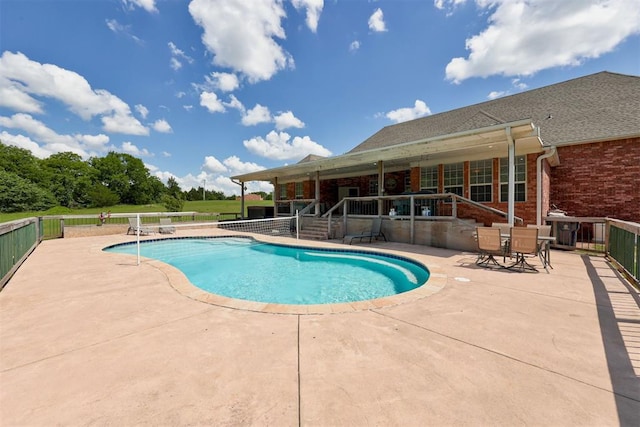11409 SW 109th St, Mustang, OK 73064 - view of swimming pool featuring a patio