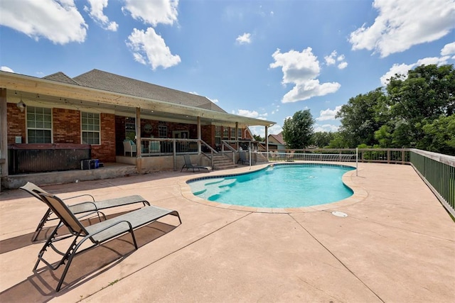 11409 SW 109th St, Mustang, OK 73064 - view of swimming pool with a patio area