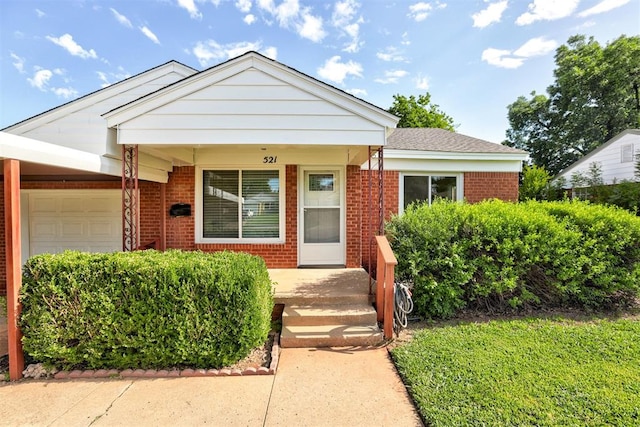 521 NW 50th St, Oklahoma City, OK 73118 - view of front facade with brick siding, an attached garage, and a porch