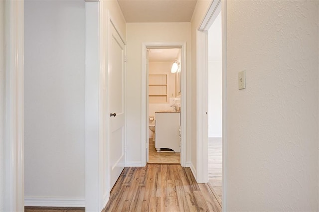 521 NW 50th St, Oklahoma City, OK 73118 - corridor featuring light wood-type flooring and baseboards