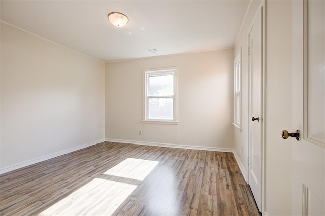 521 NW 50th St, Oklahoma City, OK 73118 - unfurnished room featuring wood finished floors and baseboards