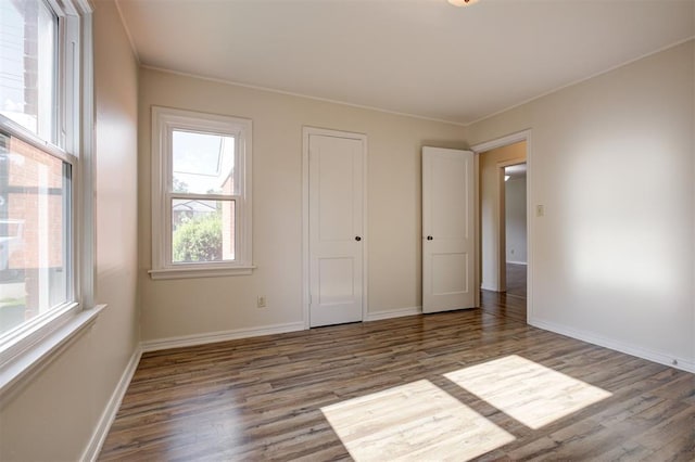 521 NW 50th St, Oklahoma City, OK 73118 - unfurnished bedroom featuring wood finished floors and ornamental molding