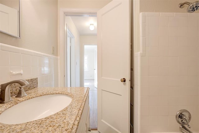 521 NW 50th St, Oklahoma City, OK 73118 - full bath with vanity, washtub / shower combination, and tile walls