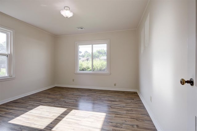 521 NW 50th St, Oklahoma City, OK 73118 - spare room featuring wood finished floors and baseboards