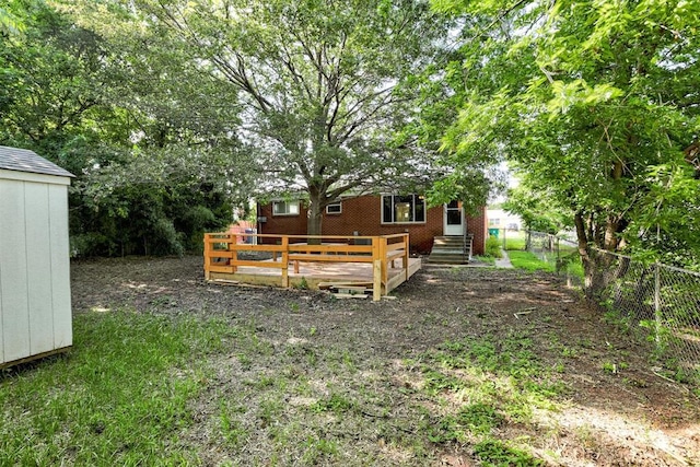 521 NW 50th St, Oklahoma City, OK 73118 - view of yard featuring a storage shed and a wooden deck