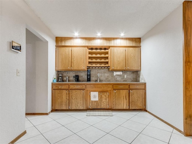 700 S Willowood Dr, Yukon, OK 73099 - kitchen featuring decorative backsplash, brown cabinetry, light tile patterned floors, open shelves, and recessed lighting