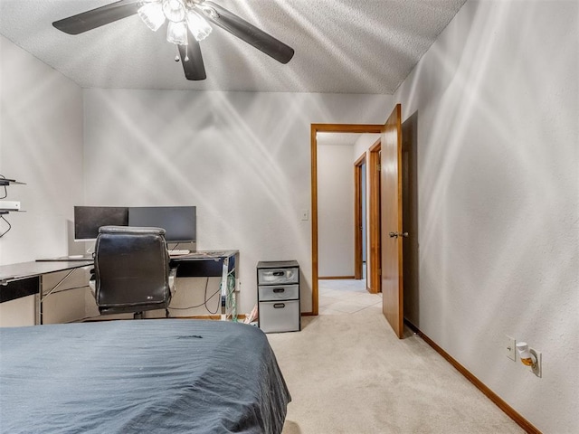 700 S Willowood Dr, Yukon, OK 73099 - bedroom with light carpet, a textured ceiling, and a ceiling fan