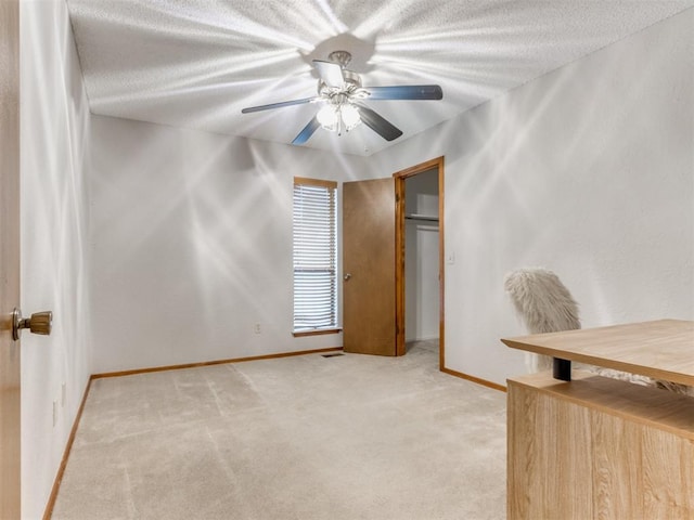 700 S Willowood Dr, Yukon, OK 73099 - unfurnished office with light colored carpet, a textured ceiling, and ceiling fan