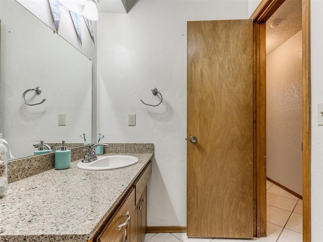 700 S Willowood Dr, Yukon, OK 73099 - bathroom with tile patterned floors and vanity