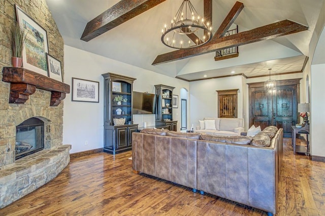 9020 NW 147th Ter, Yukon, OK 73099 - living room featuring beam ceiling, a chandelier, dark wood-style floors, high vaulted ceiling, and a fireplace