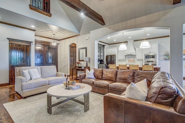 9020 NW 147th Ter, Yukon, OK 73099 - living room with arched walkways, ornamental molding, hardwood / wood-style floors, recessed lighting, and high vaulted ceiling