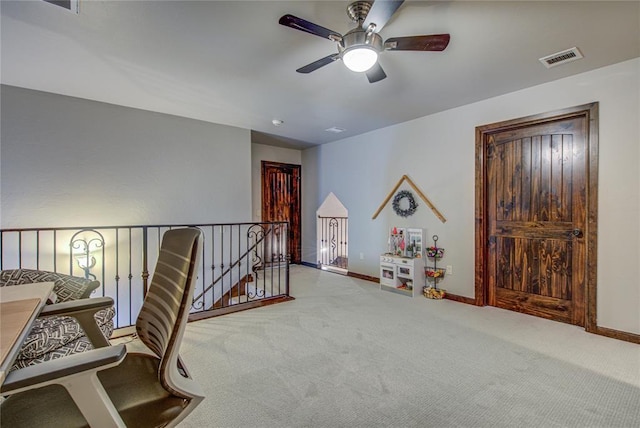 9020 NW 147th Ter, Yukon, OK 73099 - sitting room with an upstairs landing, carpet floors, and ceiling fan