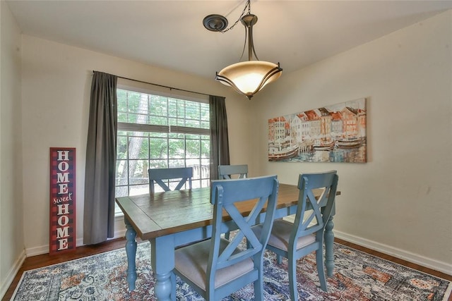 8800 Stoneleigh Ct, Oklahoma City, OK 73132 - dining space featuring baseboards and wood finished floors
