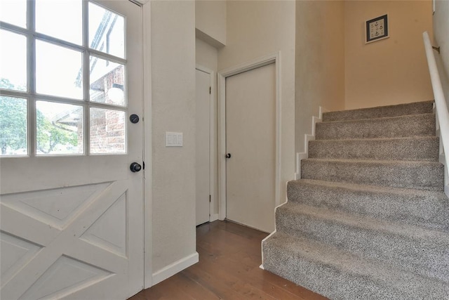 8800 Stoneleigh Ct, Oklahoma City, OK 73132 - staircase with wood finished floors and healthy amount of natural light