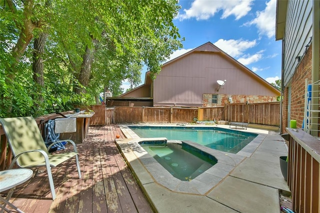 8800 Stoneleigh Ct, Oklahoma City, OK 73132 - view of pool with a deck, a fenced backyard, and a pool with connected hot tub