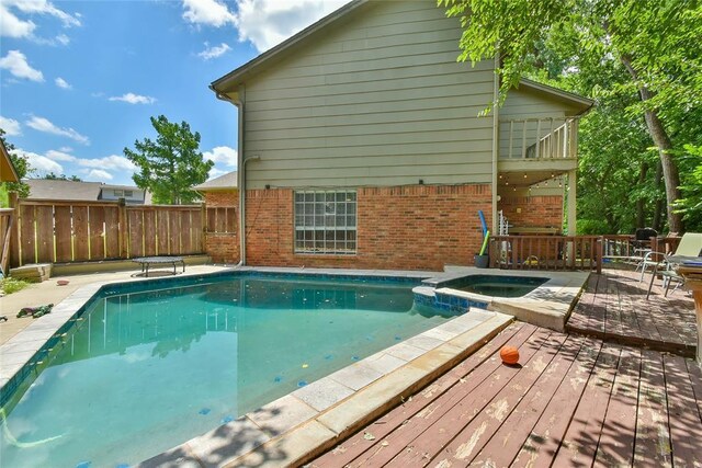 8800 Stoneleigh Ct, Oklahoma City, OK 73132 - view of swimming pool featuring a deck and a pool with connected hot tub