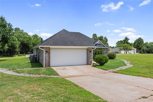 2719 NW 30th St, Newcastle, OK 73065 - view of front of property with a front yard, driveway, a garage, and roof with shingles