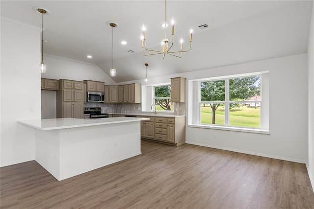 2719 NW 30th St, Newcastle, OK 73065 - kitchen featuring stainless steel microwave, electric range, light countertops, tasteful backsplash, and light wood finished floors
