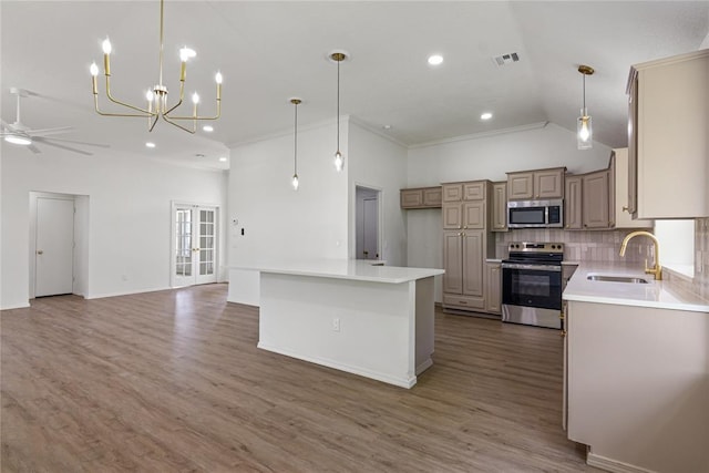 2719 NW 30th St, Newcastle, OK 73065 - kitchen featuring stainless steel appliances, open floor plan, tasteful backsplash, a ceiling fan, and light wood finished floors