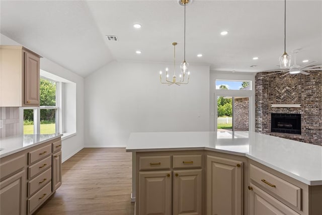 2719 NW 30th St, Newcastle, OK 73065 - kitchen with a brick fireplace, light wood-type flooring, light countertops, open floor plan, and recessed lighting