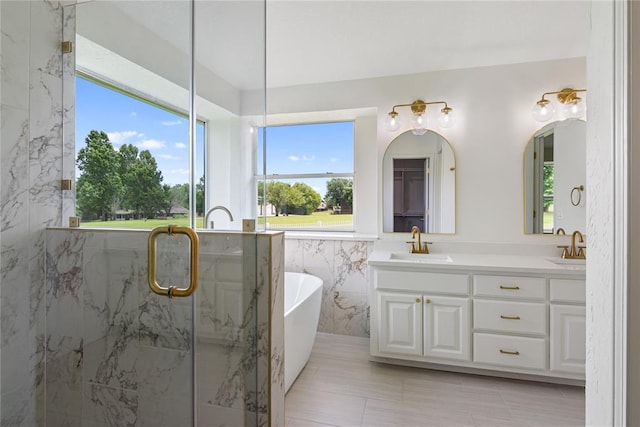 2719 NW 30th St, Newcastle, OK 73065 - full bathroom with double vanity, a freestanding tub, a marble finish shower, and tile walls