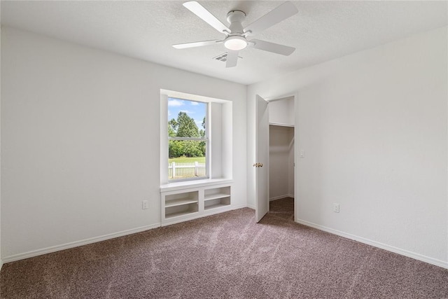 2719 NW 30th St, Newcastle, OK 73065 - unfurnished bedroom featuring carpet floors, a ceiling fan, and a textured ceiling