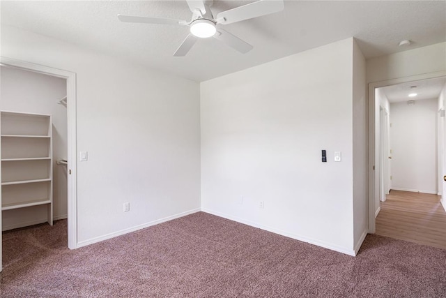2719 NW 30th St, Newcastle, OK 73065 - unfurnished bedroom with carpet, a spacious closet, and a ceiling fan
