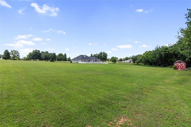 2719 NW 30th St, Newcastle, OK 73065 - view of green lawn featuring an outdoor structure and a view of rural / pastoral area