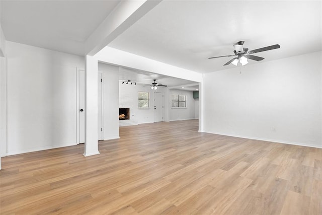 9617 Georgia Ave, Oklahoma City, OK 73120 - unfurnished living room with ceiling fan, light wood finished floors, and a fireplace