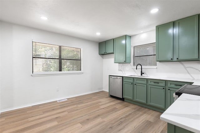 9617 Georgia Ave, Oklahoma City, OK 73120 - kitchen with green cabinetry, stainless steel dishwasher, light countertops, light wood-type flooring, and recessed lighting