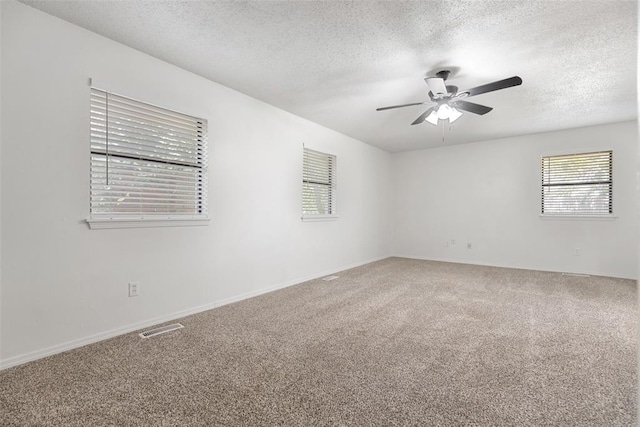9617 Georgia Ave, Oklahoma City, OK 73120 - carpeted spare room featuring a textured ceiling and a ceiling fan