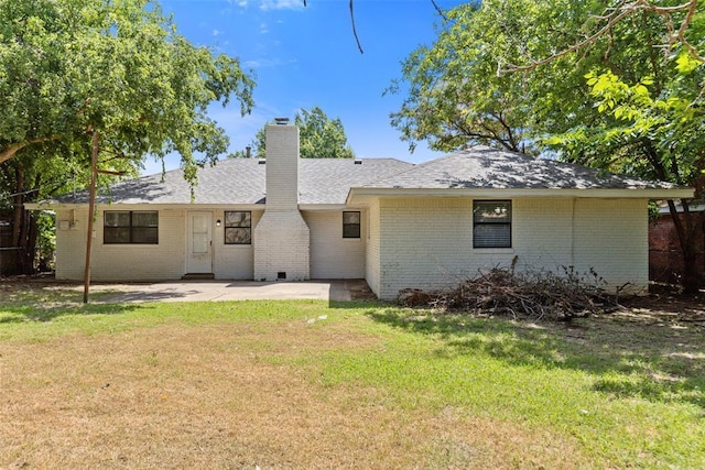 9617 Georgia Ave, Oklahoma City, OK 73120 - back of house featuring brick siding, a chimney, and a patio
