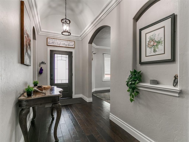 7032 NW 159th Pl, Edmond, OK 73013 - entrance foyer featuring arched walkways, dark wood-style floors, lofted ceiling, a textured wall, and crown molding