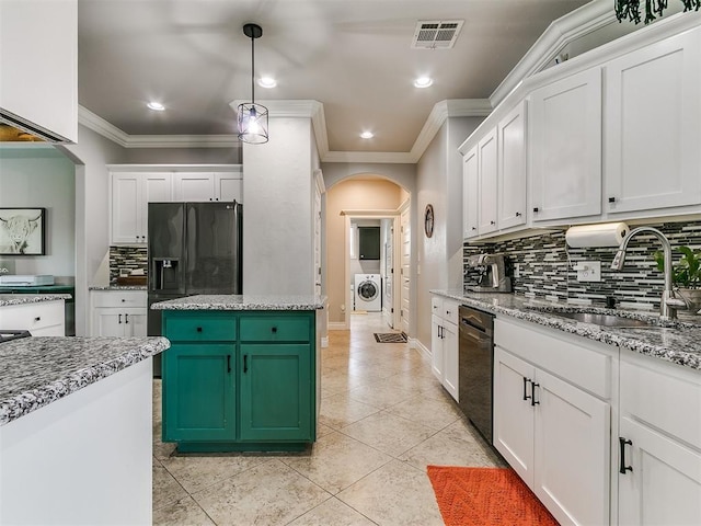 7032 NW 159th Pl, Edmond, OK 73013 - kitchen with arched walkways, washer / clothes dryer, crown molding, dishwasher, and decorative backsplash