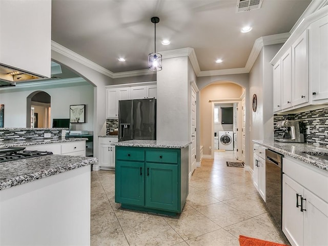 7032 NW 159th Pl, Edmond, OK 73013 - kitchen featuring black fridge, tasteful backsplash, arched walkways, dishwasher, and ornamental molding